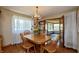Inviting dining room with hardwood floors and a beautiful chandelier at 614 Debra Ln, Indianapolis, IN 46217