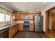 Well-equipped kitchen featuring stainless steel appliances and tile backsplash at 614 Debra Ln, Indianapolis, IN 46217