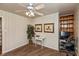 Bright home office features a ceiling fan and built-in shelving for an organized workspace at 614 Debra Ln, Indianapolis, IN 46217