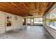 Bright sunroom with wood ceiling, large windows and a neutral color palette at 614 Debra Ln, Indianapolis, IN 46217