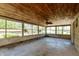 Spacious sunroom with floor-to-ceiling windows and a wooden ceiling offering natural light and views at 614 Debra Ln, Indianapolis, IN 46217