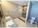 Luxurious bathroom with double sinks, granite countertops, and a modern glass-enclosed shower at 6157 Winthrop Ave, Indianapolis, IN 46220