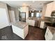 Bright kitchen with stainless steel appliances, granite countertops, and center island at 6157 Winthrop Ave, Indianapolis, IN 46220