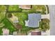 Aerial view of a home with a spacious backyard, patio, storage shed and well-maintained lawn at 6159 Connie Ct, Indianapolis, IN 46237