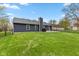Expansive backyard with a lush lawn, perfect for recreation, and a private patio area for outdoor gatherings at 6159 Connie Ct, Indianapolis, IN 46237