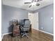 Bedroom showcasing hardwood floors, a ceiling fan and a work space with a desk and rolling chair at 6159 Connie Ct, Indianapolis, IN 46237