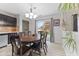 Sunny dining area with sliding glass doors that lead to outdoor space at 6159 Connie Ct, Indianapolis, IN 46237