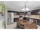 Eat-in kitchen features stainless steel appliances, and a wooden dining table at 6159 Connie Ct, Indianapolis, IN 46237