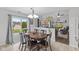 Bright dining area with sliding glass doors and an adjacent living room at 6159 Connie Ct, Indianapolis, IN 46237