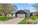 Well-maintained home featuring a two-car garage, neat landscaping, and attractive exterior finishes at 6159 Connie Ct, Indianapolis, IN 46237