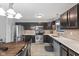 Modern kitchen featuring stainless steel appliances and a wooden dining table at 6159 Connie Ct, Indianapolis, IN 46237