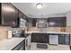 Well-equipped kitchen with stainless steel appliances and light countertops at 6159 Connie Ct, Indianapolis, IN 46237
