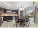 Eat-in kitchen featuring updated appliances, cabinetry, and a sliding glass door to the exterior at 6159 Connie Ct, Indianapolis, IN 46237
