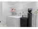 Laundry room with modern washer and dryer and shelving for storage at 6159 Connie Ct, Indianapolis, IN 46237