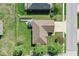 Aerial view showcases the house with a pristine lawn, mulch path, and charming gazebo at 6232 Buck Trail Rd, Indianapolis, IN 46237