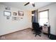 Bedroom with ceiling fan, desk and chair, and neutral colored walls at 6232 Buck Trail Rd, Indianapolis, IN 46237