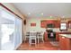 Bright eat-in kitchen features stainless appliances and sliding glass door for outdoor access at 6232 Buck Trail Rd, Indianapolis, IN 46237