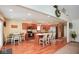 Spacious kitchen features wood cabinets, stainless steel appliances, and a center island with seating at 6232 Buck Trail Rd, Indianapolis, IN 46237