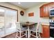 Eat-in kitchen area with sliding glass door to patio at 6232 Buck Trail Rd, Indianapolis, IN 46237