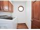 Laundry room with washer, dryer, and cabinet storage at 6232 Buck Trail Rd, Indianapolis, IN 46237