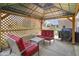 Covered patio features seating and grill area at 6232 Buck Trail Rd, Indianapolis, IN 46237