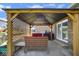 A covered patio offers seating and a grill at 6232 Buck Trail Rd, Indianapolis, IN 46237