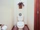 Powder room features a toilet and decor at 6232 Buck Trail Rd, Indianapolis, IN 46237