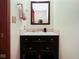 Powder room with modern vanity and mirror at 6232 Buck Trail Rd, Indianapolis, IN 46237
