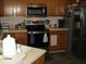 Kitchen with stainless steel appliances and ample counter space for cooking at 6350 Emerald Springs Dr, Indianapolis, IN 46221