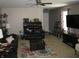 Comfortable living room with ample seating, a ceiling fan, and neutral carpeting at 6350 Emerald Springs Dr, Indianapolis, IN 46221