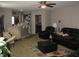 Spacious living room with neutral walls, comfortable seating, and a ceiling fan at 6350 Emerald Springs Dr, Indianapolis, IN 46221