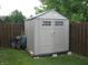 Outdoor shed with a gable roof, double doors, and surrounded by a wooden fence at 6350 Emerald Springs Dr, Indianapolis, IN 46221