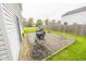 Wooden deck with grass yard, vinyl siding on the two-story house at 6376 Matcumbe Way, Plainfield, IN 46168