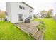 Large deck and backyard featuring grass and a white vinyl sided two-story house at 6376 Matcumbe Way, Plainfield, IN 46168
