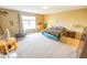 Spacious carpeted bedroom with a large window and neutral paint colors at 6376 Matcumbe Way, Plainfield, IN 46168