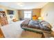 Bedroom featuring carpeted floors, natural lighting, and standard furnishings at 6376 Matcumbe Way, Plainfield, IN 46168