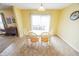 Light-filled dining room with a wooden table, seating for six, and a sliding glass door at 6376 Matcumbe Way, Plainfield, IN 46168
