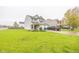 Two-story home featuring neutral siding, brick accents, attached two-car garage and well-maintained lawn at 6376 Matcumbe Way, Plainfield, IN 46168