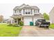 Charming two-story home featuring neutral siding, brick accents, two-car garage and well-maintained lawn at 6376 Matcumbe Way, Plainfield, IN 46168