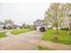 Two-story home featuring neutral siding, brick accents, attached two-car garage and well-maintained lawn at 6376 Matcumbe Way, Plainfield, IN 46168