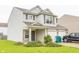 Two-story home featuring neutral siding, brick accents, attached two-car garage and well-maintained lawn at 6376 Matcumbe Way, Plainfield, IN 46168