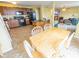 Open concept kitchen, dining, and living room area with tan paint and ceramic tile flooring at 6376 Matcumbe Way, Plainfield, IN 46168