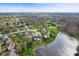 Scenic aerial shot of a neighborhood featuring well-maintained homes and a tranquil pond at 6514 Trevia Ct, Indianapolis, IN 46236