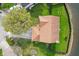 Aerial view of a well-maintained home with a lush lawn and mature trees at 6514 Trevia Ct, Indianapolis, IN 46236