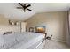 Bedroom featuring neutral walls, a ceiling fan, and a television on a stand at 6514 Trevia Ct, Indianapolis, IN 46236