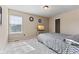 Cozy bedroom with neutral walls, plush carpet, and large window at 6514 Trevia Ct, Indianapolis, IN 46236