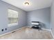 Cozy bedroom with a large window, neutral colors, and a comfortable play area at 6514 Trevia Ct, Indianapolis, IN 46236