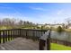 Enjoy the wood deck overlooking a serene pond and lush green surroundings at 6514 Trevia Ct, Indianapolis, IN 46236