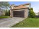 Attractive home with a two-car garage, brick accents, well-kept lawn, and manicured landscaping at 6514 Trevia Ct, Indianapolis, IN 46236