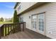 Charming home exterior featuring a wood deck and French doors leading to the backyard at 6514 Trevia Ct, Indianapolis, IN 46236